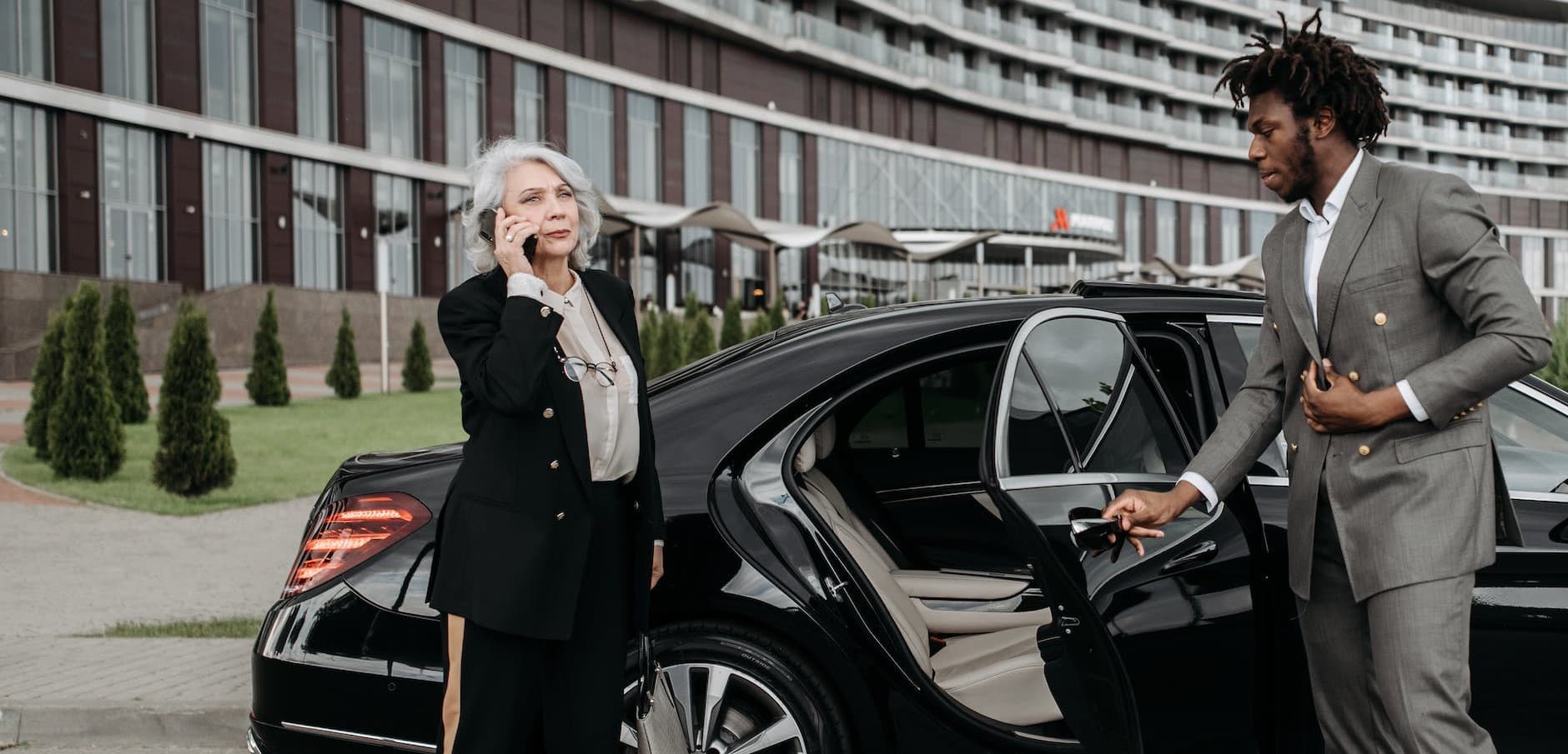 Formal woman leaving her hired car
